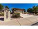 View of house with front yard desert landscaping and private two car garage at 16902 W Marcos De Niza Dr, Surprise, AZ 85387