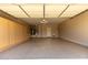 Spacious garage with epoxy flooring, a utility sink and built-in cabinets offers ample storage space at 16902 W Marcos De Niza Dr, Surprise, AZ 85387