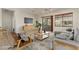 Bright living room with a large window, wood accents, and plush seating at 16902 W Marcos De Niza Dr, Surprise, AZ 85387