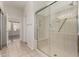 Bathroom with tiled floor and glass enclosed shower at 16902 W Marcos De Niza Dr, Surprise, AZ 85387