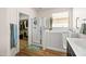 Bright bathroom featuring a walk-in shower, walk-in bathtub, and walk-in closet at 1705 W Stephanie Ln, San Tan Valley, AZ 85144