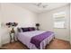 Bedroom featuring a ceiling fan, natural light, and carpet floors at 1705 W Stephanie Ln, San Tan Valley, AZ 85144