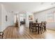 Bright dining room with a wooden table and seating for six, blending seamlessly with living area at 1705 W Stephanie Ln, San Tan Valley, AZ 85144