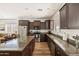 Spacious kitchen with granite countertops, stainless steel appliances, and ample storage space at 1705 W Stephanie Ln, San Tan Valley, AZ 85144