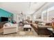 Open living area with a large brown sectional sofa, decorative rug and an accent wall at 1705 W Stephanie Ln, San Tan Valley, AZ 85144