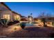 Stunning pool area with lush desert landscaping, creating a private and inviting oasis at 1705 W Stephanie Ln, San Tan Valley, AZ 85144
