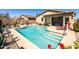Sparkling pool featuring a tanning shelf, steps, and views of the back of the house at 1705 W Stephanie Ln, San Tan Valley, AZ 85144