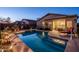 Beautiful pool with patio, desert landscaping, and seamless indoor-outdoor living at 1705 W Stephanie Ln, San Tan Valley, AZ 85144