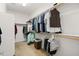 A walk-in closet with custom storage solutions and ample shelving at 1705 W Stephanie Ln, San Tan Valley, AZ 85144