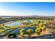 Aerial shot of the golf course and lake with mountain views in the distance at 1750 N Abner --, Mesa, AZ 85205