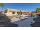 Private backyard oasis featuring a pool, covered patio, and well-manicured landscaping at 1750 N Abner --, Mesa, AZ 85205