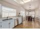 Bright eat-in kitchen with white cabinets, stainless appliances, and tile flooring at 1750 N Abner --, Mesa, AZ 85205