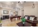 Inviting living room with tile flooring, a cozy couch, and a pool table ready for entertaining at 1750 N Abner --, Mesa, AZ 85205
