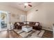 Comfortable living room with a large sectional sofa, stylish decor, and wood-look flooring at 1750 N Abner --, Mesa, AZ 85205