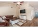 Relaxing living room with a sectional, TV, and neutral decor, perfect for comfortable gatherings at 1750 N Abner --, Mesa, AZ 85205