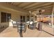 Covered patio with comfortable seating and a heater, perfect for outdoor relaxation at 1750 N Abner --, Mesa, AZ 85205
