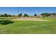 Enjoy the community volleyball court on a lush green space with mature trees at 1750 N Abner --, Mesa, AZ 85205