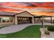 An expansive lawn bordered by a brick patio that offers an outdoor retreat connecting seamlessly with indoor living spaces at 21647 S 223Rd Pl, Queen Creek, AZ 85142