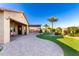 Expansive backyard features a seamlessly integrated patio, lush artificial turf, and mature landscaping at 21647 S 223Rd Pl, Queen Creek, AZ 85142