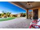 Palm trees, a patio, desert landscaping, and a storage shed enhance the appeal of this property's outdoor space at 21647 S 223Rd Pl, Queen Creek, AZ 85142