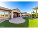 Discover an expansive lawn bordered by a brick patio that offers an outdoor retreat connecting seamlessly with indoor living spaces at 21647 S 223Rd Pl, Queen Creek, AZ 85142