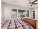 Bright bedroom with a large window and comfortable furnishings at 21647 S 223Rd Pl, Queen Creek, AZ 85142