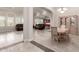 Open-concept dining area with tile flooring and view to the kitchen and living areas at 21647 S 223Rd Pl, Queen Creek, AZ 85142