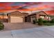 Beautiful home boasts a brick driveway and two-car garage with ample space for parking at 21647 S 223Rd Pl, Queen Creek, AZ 85142