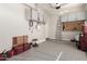 Well-organized garage with epoxy flooring, storage cabinets, and ample space for vehicles and projects at 21647 S 223Rd Pl, Queen Creek, AZ 85142