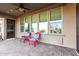 Step onto this home's shaded patio, perfect for relaxation and outdoor living with views of its manicured backyard at 21647 S 223Rd Pl, Queen Creek, AZ 85142