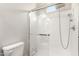 Clean, white shower with glass door and shower head with hose, offering modern bathroom comfort at 21647 S 223Rd Pl, Queen Creek, AZ 85142