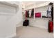 Spacious walk-in closet with built-in shelves and rods for ample storage space at 21647 S 223Rd Pl, Queen Creek, AZ 85142