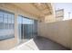 The enclosed balcony features a sliding glass door providing seamless indoor-outdoor flow at 2646 N 43Rd Ave # B, Phoenix, AZ 85009