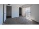 This bedroom has neutral carpeting, and a large sliding glass door to the balcony at 2646 N 43Rd Ave # B, Phoenix, AZ 85009
