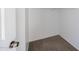Walk in closet with neutral carpeting and white walls provides ample storage space at 2646 N 43Rd Ave # B, Phoenix, AZ 85009