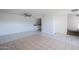 Bright living space features ceiling fan, tile flooring and access to kitchen at 2646 N 43Rd Ave # B, Phoenix, AZ 85009