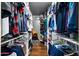 Well-organized walk-in closet with clothing racks and shelves, maximizing storage space at 2962 E Dolphin Ave, Mesa, AZ 85204