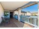 Inviting covered front porch with seating area, showcasing the home's entry and charming details at 2962 E Dolphin Ave, Mesa, AZ 85204