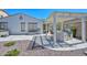 Charming backyard with desert landscaping, covered patio, outdoor kitchen, and a spa for relaxation at 29674 N 127Th Ln, Peoria, AZ 85383