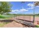 Community baseball field with a covered dugout and seating, set against a scenic desert backdrop at 29674 N 127Th Ln, Peoria, AZ 85383