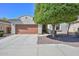 Charming single-story home with a well-maintained front yard and a two-car garage, offering curb appeal and convenience at 29674 N 127Th Ln, Peoria, AZ 85383
