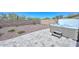 Relaxing hot tub with waterfall feature amid desert landscaping offers the perfect backyard oasis at 29674 N 127Th Ln, Peoria, AZ 85383