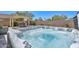 Beautiful hot tub with desert landscaping offers a relaxing outdoor retreat and al fresco experience at 29674 N 127Th Ln, Peoria, AZ 85383