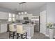 Contemporary kitchen showcasing gray accents, stainless steel appliances, and a functional kitchen island, for cooking enthusiasts at 29674 N 127Th Ln, Peoria, AZ 85383
