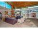 Community lounge area with comfortable seating, a fireplace, and large windows for natural light at 29674 N 127Th Ln, Peoria, AZ 85383