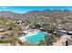 Aerial view of the community pool and spa against a backdrop of mountains at 3005 W Donatello Dr, Phoenix, AZ 85086