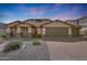 Beautiful single-Gathering home with a three car garage, desert landscaping, and a brick paver driveway at 3005 W Donatello Dr, Phoenix, AZ 85086