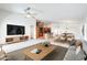 Spacious living room flows into the kitchen and dining area, creating a seamless entertaining space at 3005 W Donatello Dr, Phoenix, AZ 85086