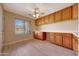 Office featuring built-in cabinets and a desk space at 3005 W Donatello Dr, Phoenix, AZ 85086