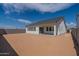 View of the backyard with privacy wall and a covered patio, perfect for outdoor enjoyment at 35658 N Lodestone Dr, San Tan Valley, AZ 85144